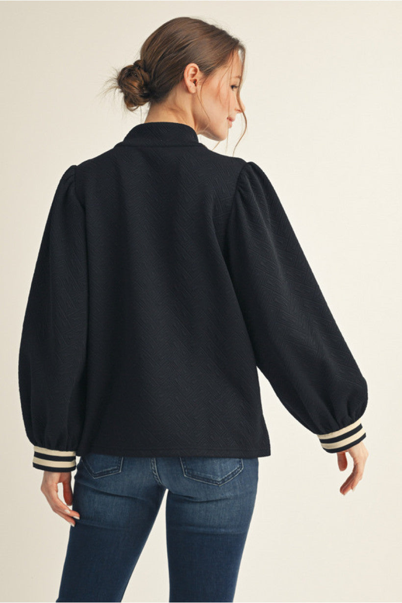 Black Long puff sleeves textured fabric solid top with front zip up, stripe contrast detail, mock neck.