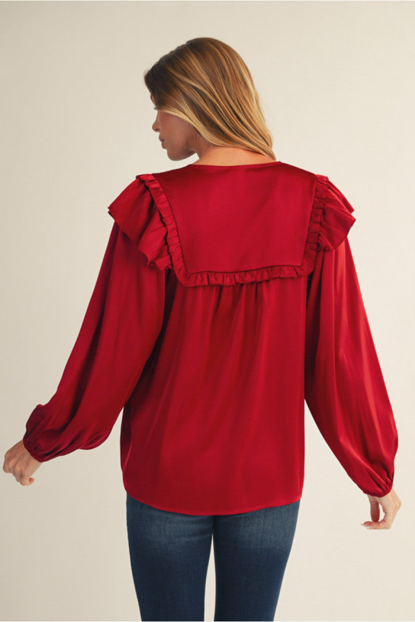 Burgundy Long puff sleeves solid satin top with ruffle detail.