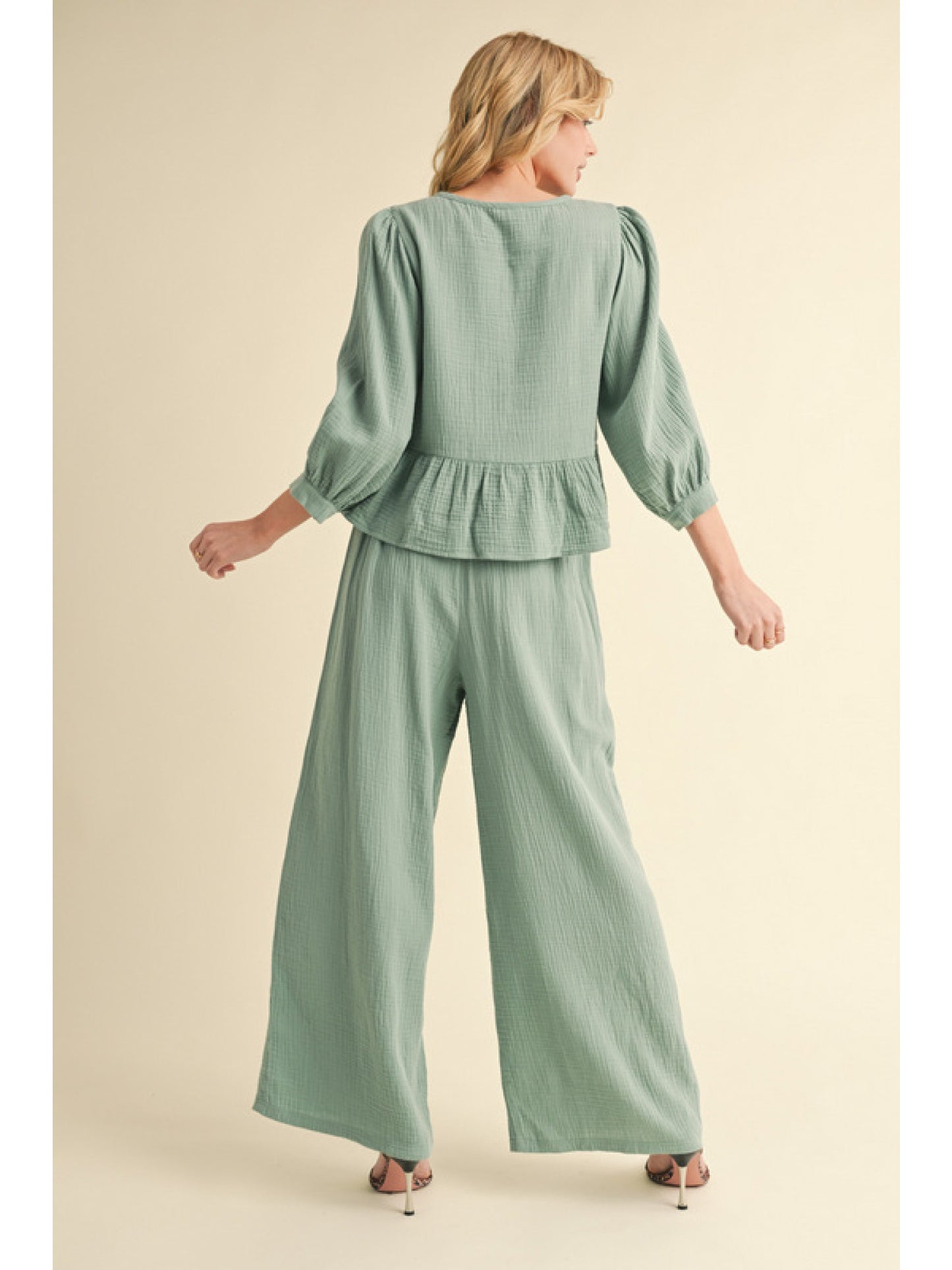 Sage Cotton loungewear set. Top is U-neck, front bow ties closure, and ruffly hemline, three quarter peasant sleeves. Bottoms have drawstring waistline, and side pockets.