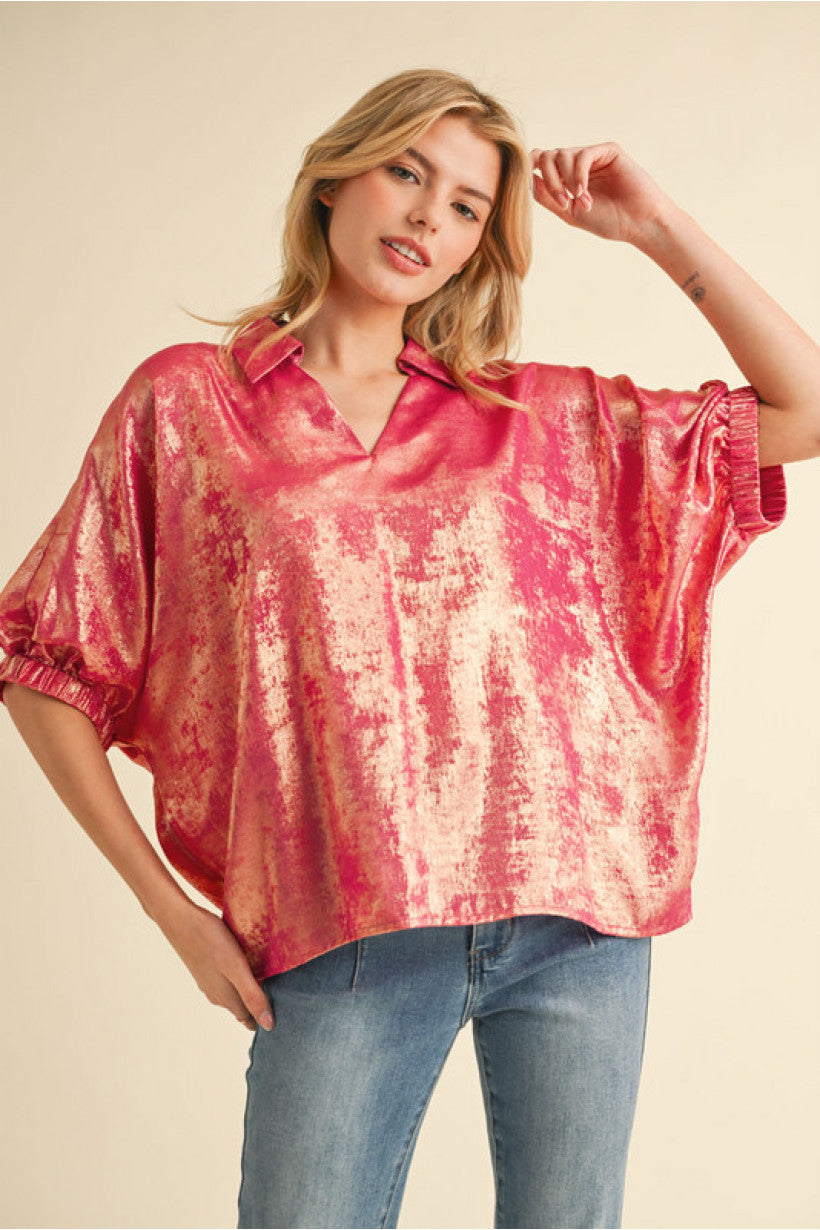 Fuchsia top with open collared neck, Half dolman sleeves, and stretch-band cuffs.