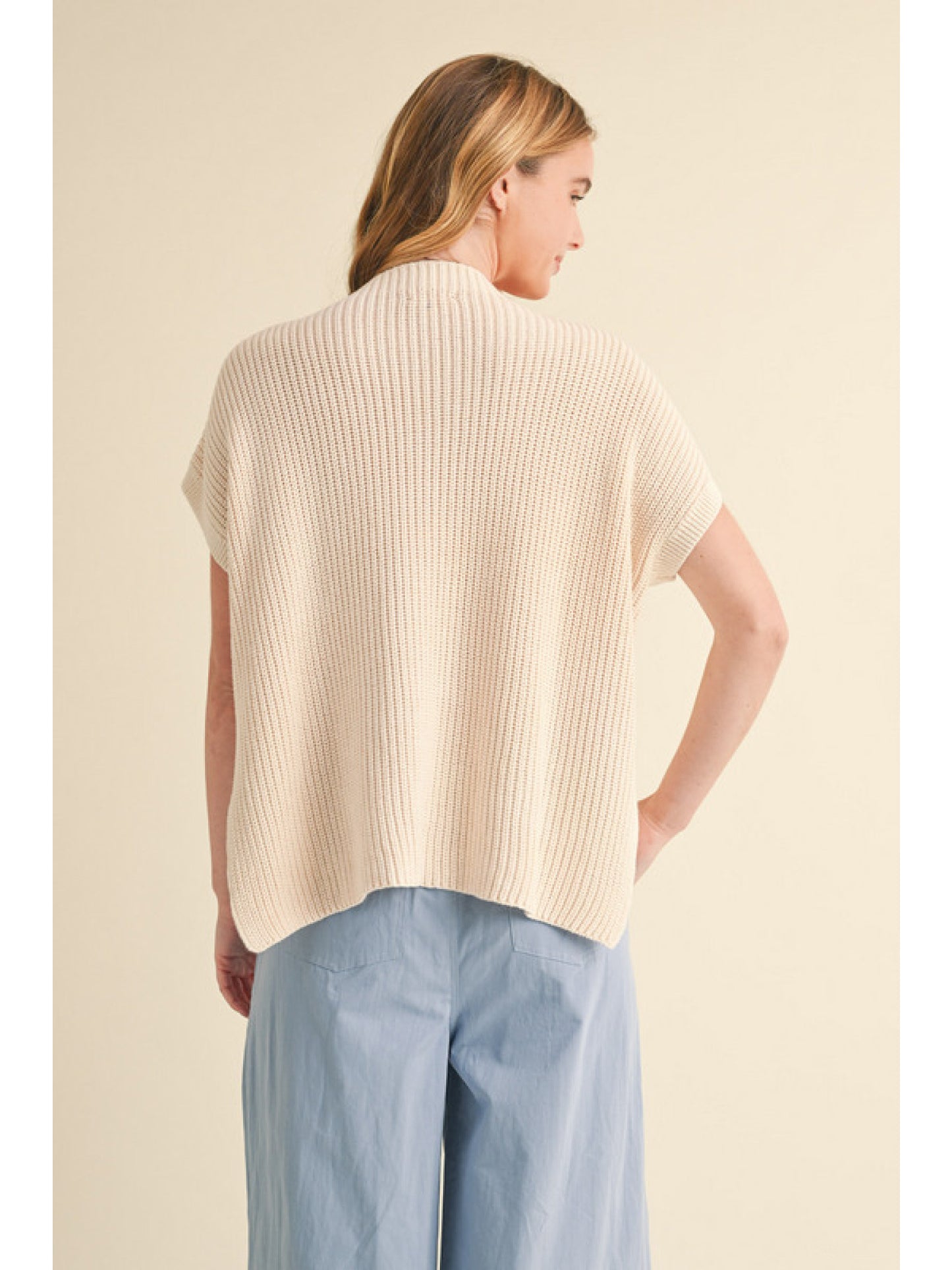 Oatmeal Textured knit top with mock neck, short kimono sleeves, and side slit detail.