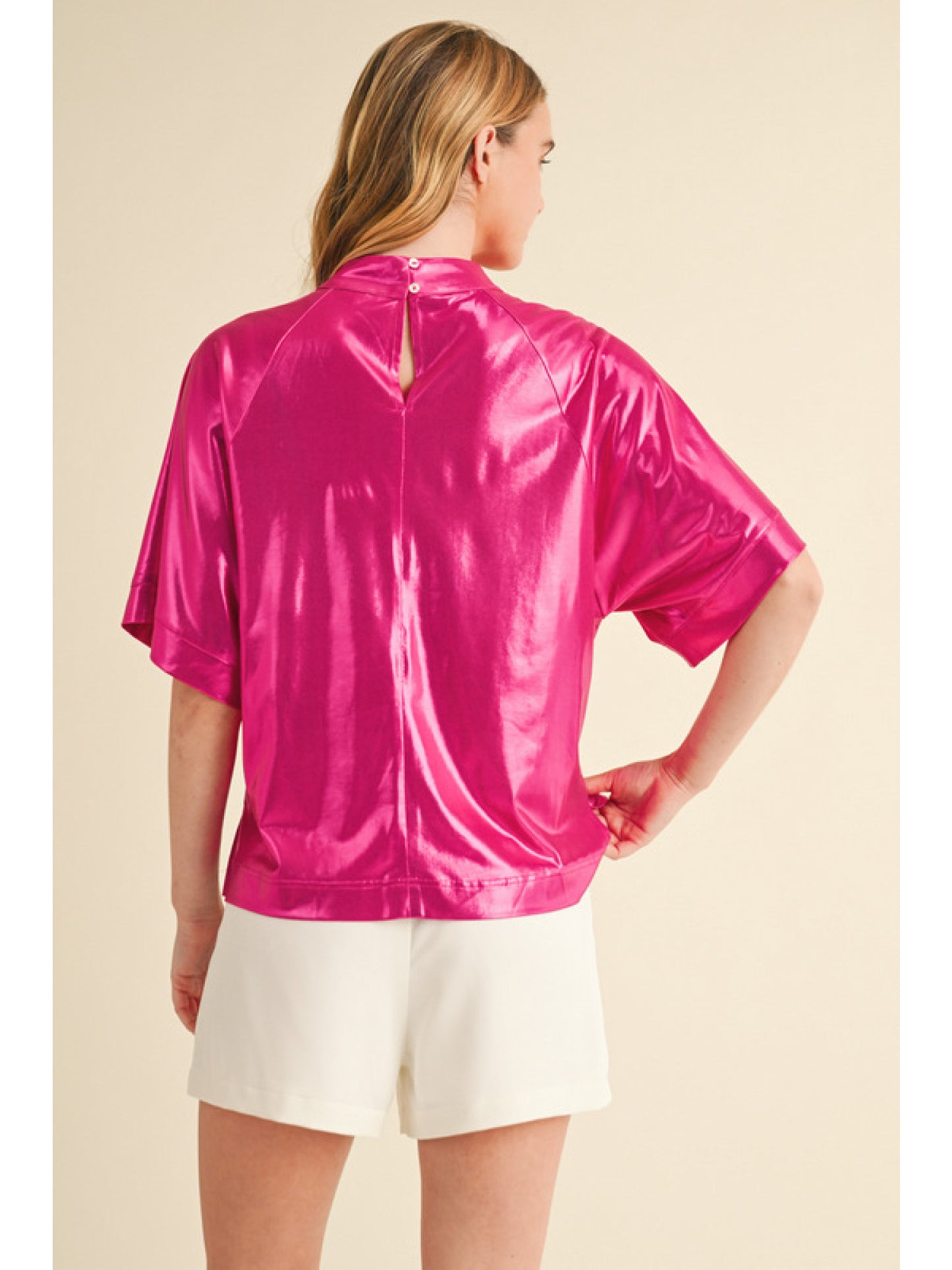 Hot Pink Glossy fabric top with mock neck, back key hole, half wide sleeves, and vented hemline.