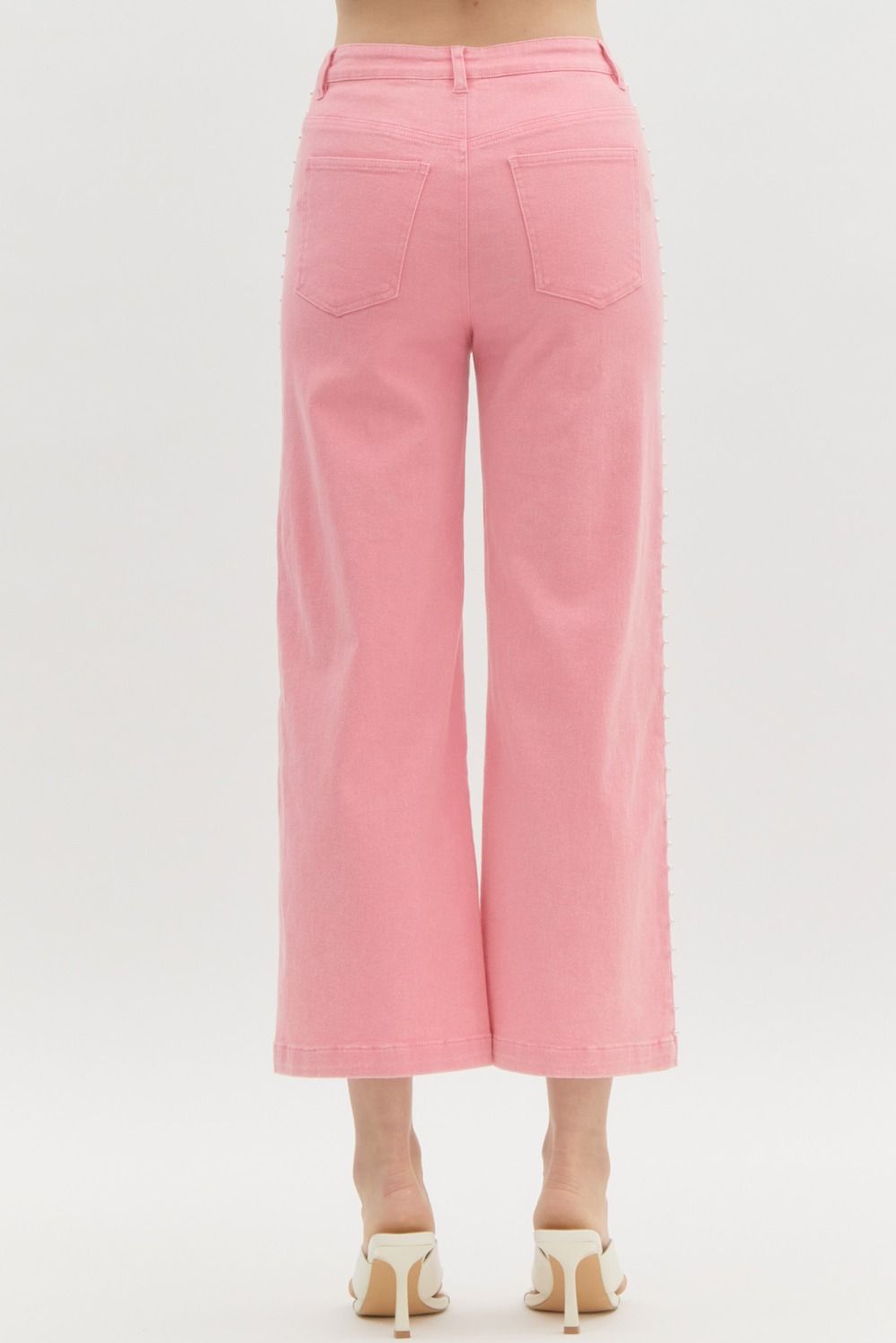 Pink high waisted denim wide leg pants featuring pearl details