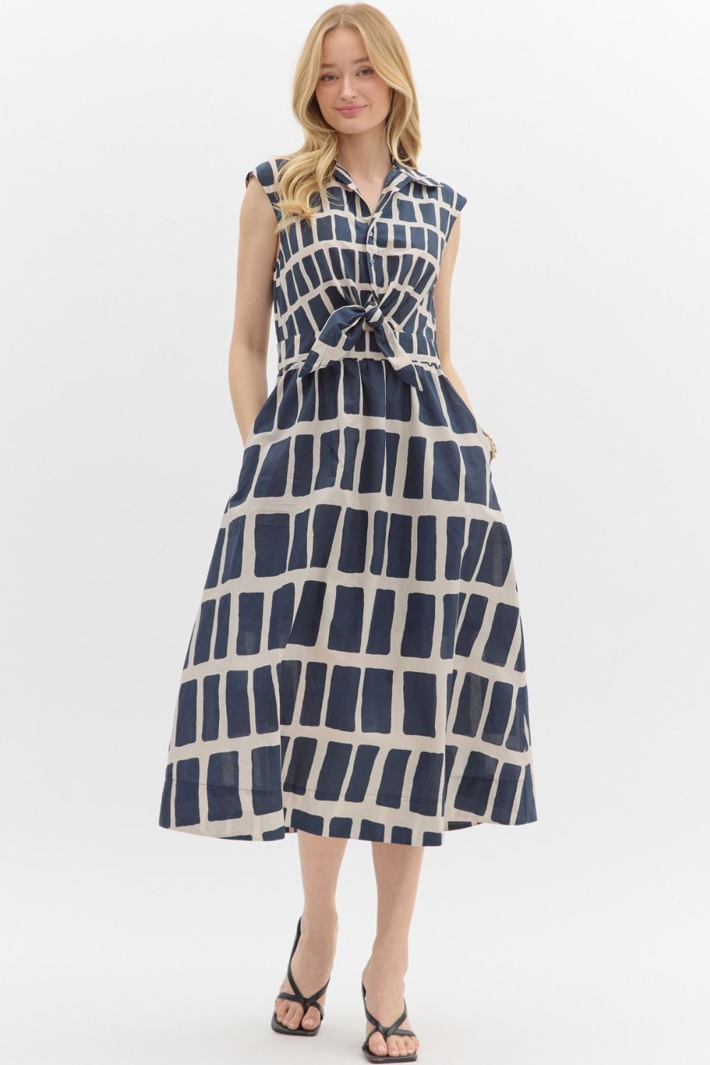 Navy Abstract print sleeveless midi dress featuring collar button front with knot closure