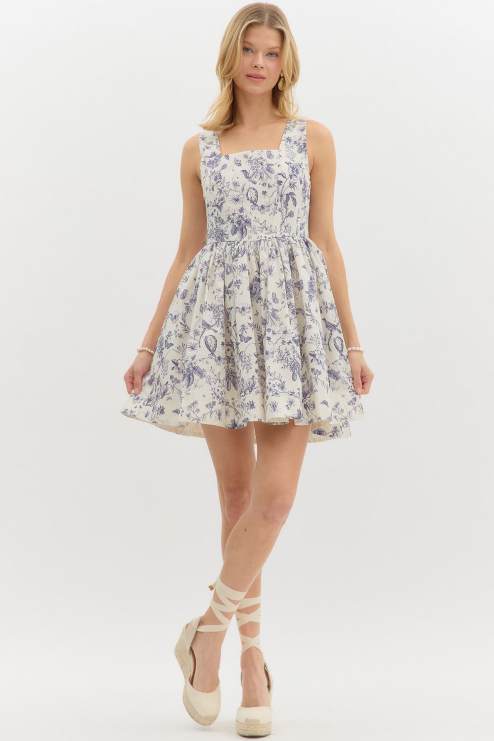 Floral print sleevless mini dress features square neckline