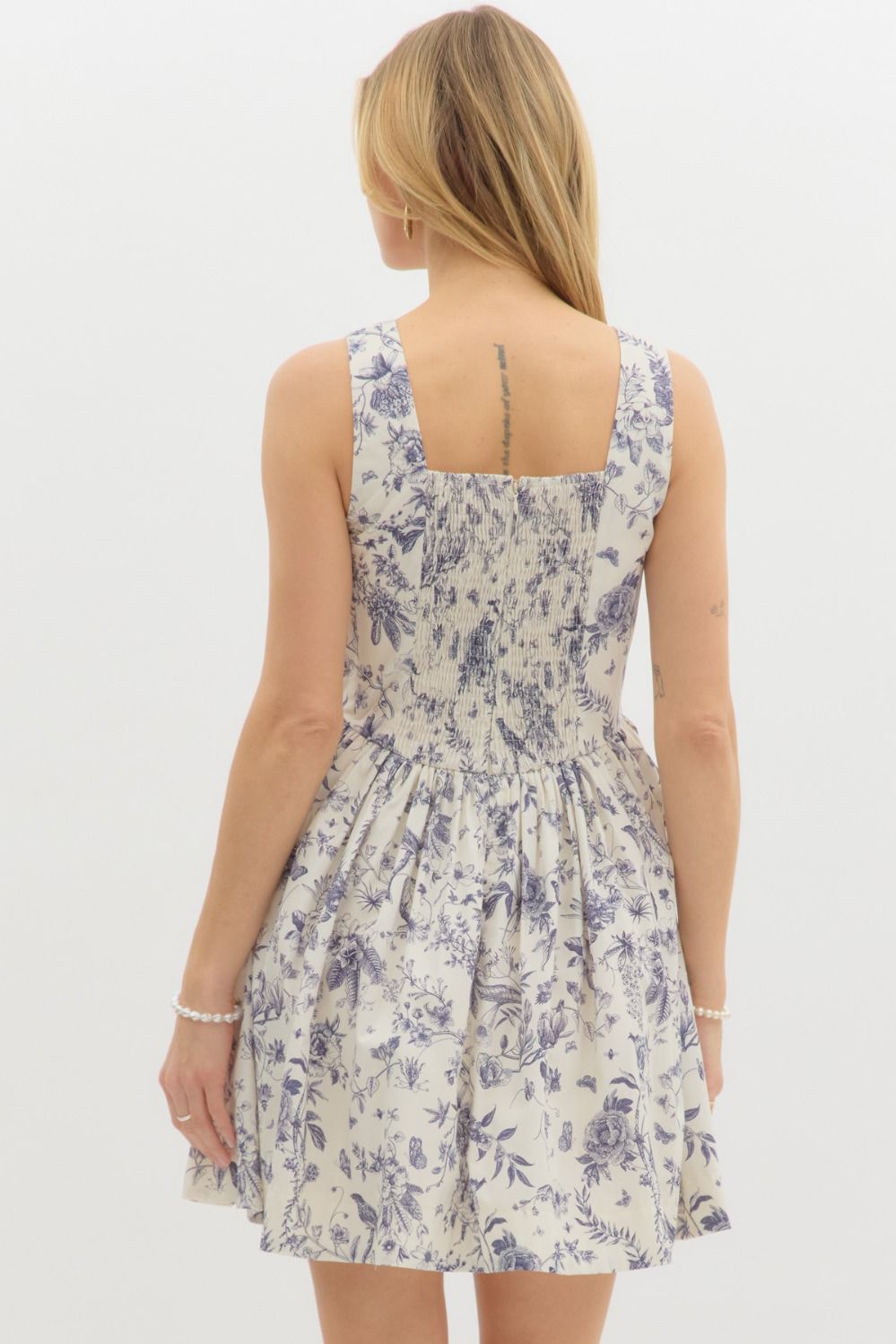 Floral print sleevless mini dress features square neckline