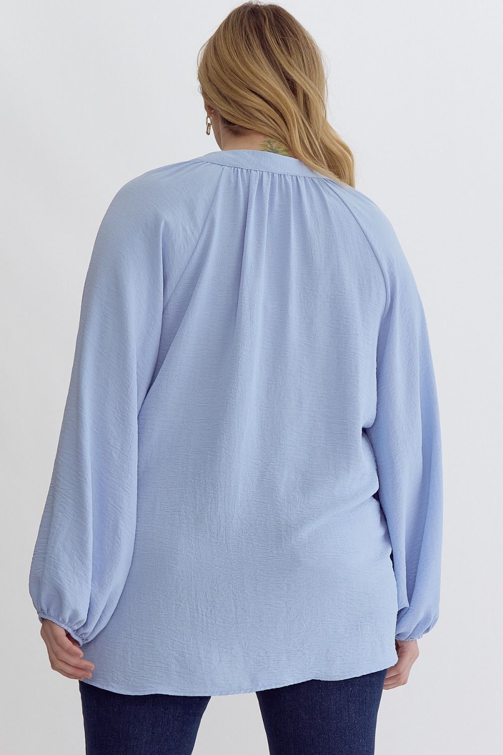 Light Blue V-neck long sleeve top featuring front placket detail