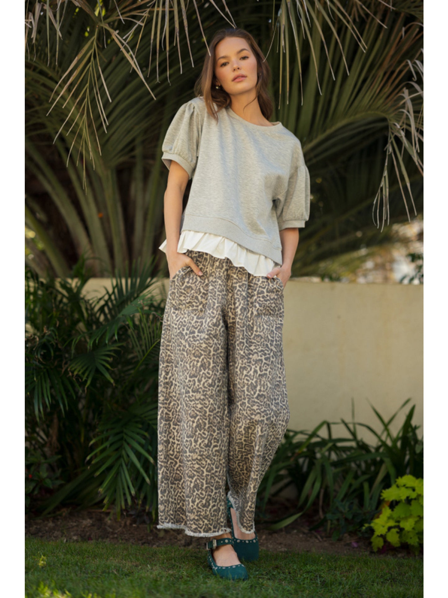 Plus leopard print pants with drawstring waistband, side pockets featuring fringe, and loose fit.