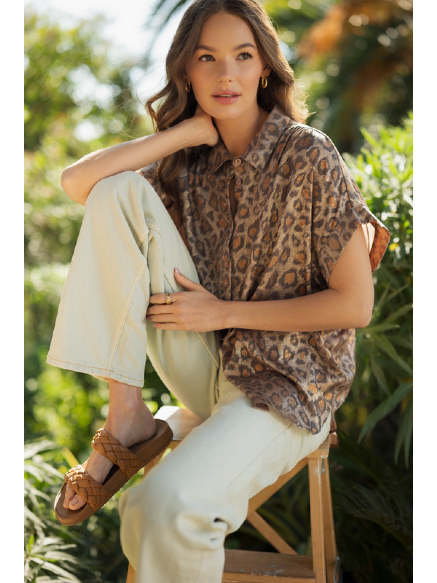 Toffee Leopard print collared button up top with cuffed short sleeves and ruched shoulders.
