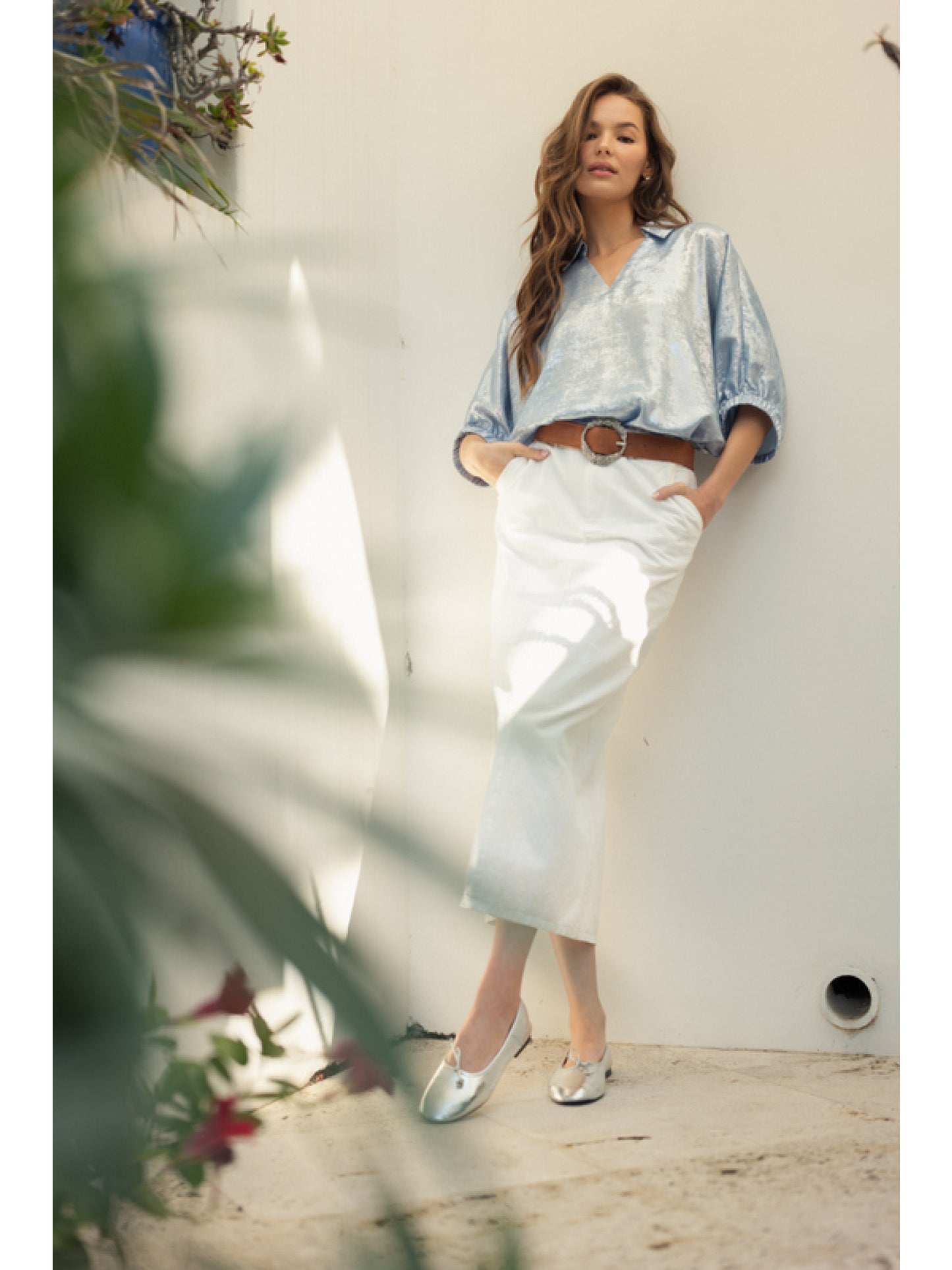 Blue Metallic top with open collared neck, Half dolman sleeves, and stretch-band cuffs.