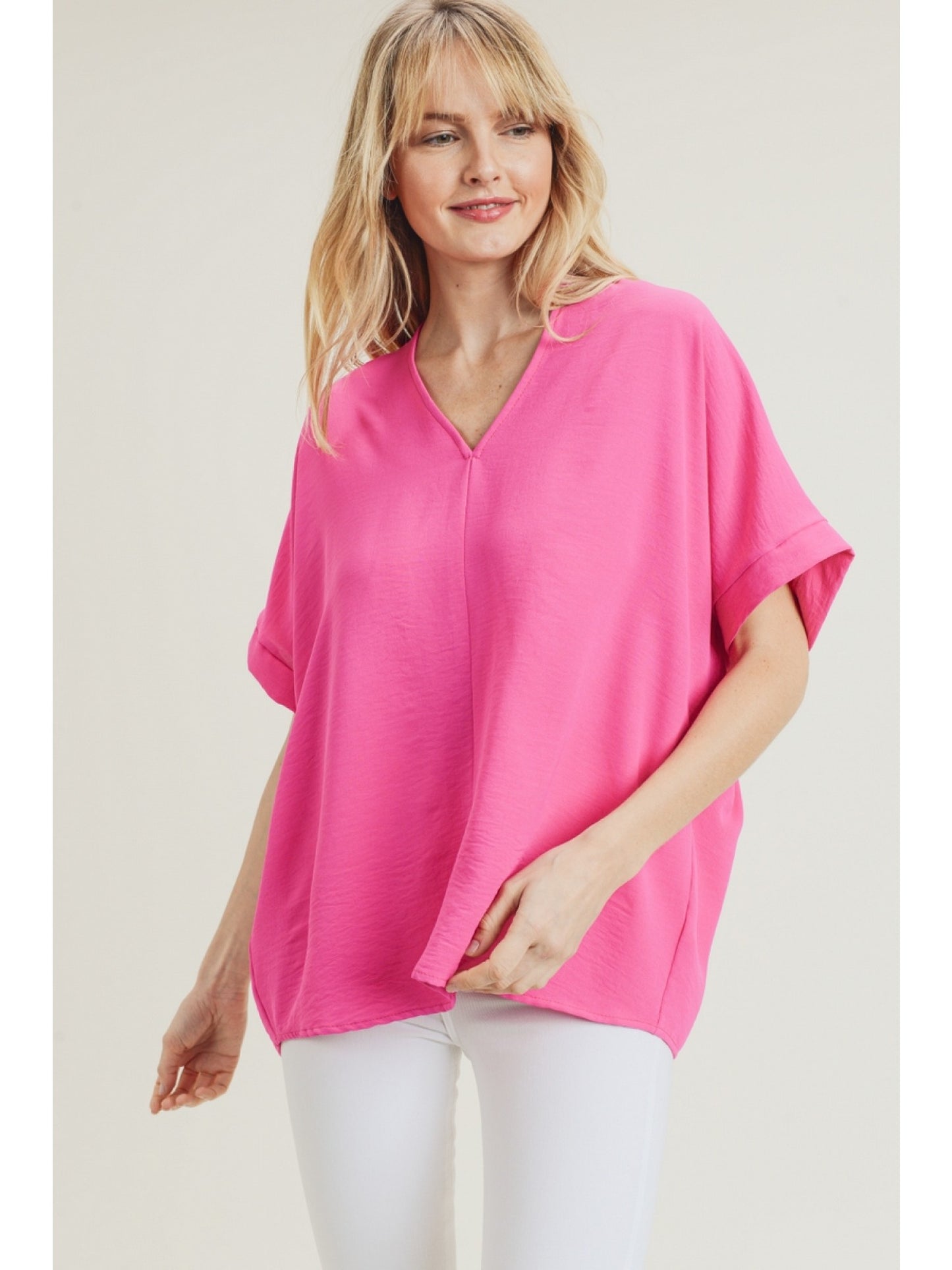 Hot Pink solid boxy top with a V-neckline and short sleeves.