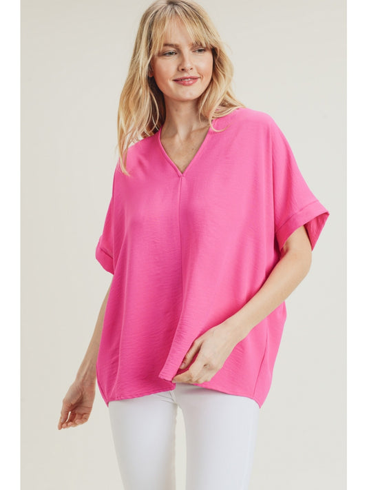 Hot Pink solid boxy top with a V-neckline and short sleeves.