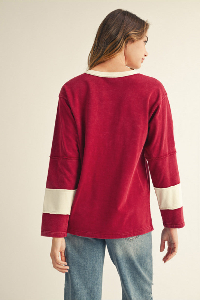 Burgundy Long sleeves color block top with big floral patch, raw cut edge accent.