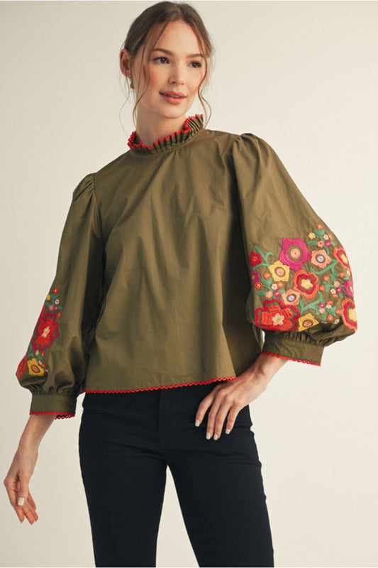 Olive 3/4 balloon sleeves top with embroidery, ruffled mock neck, lace trim edge detail.