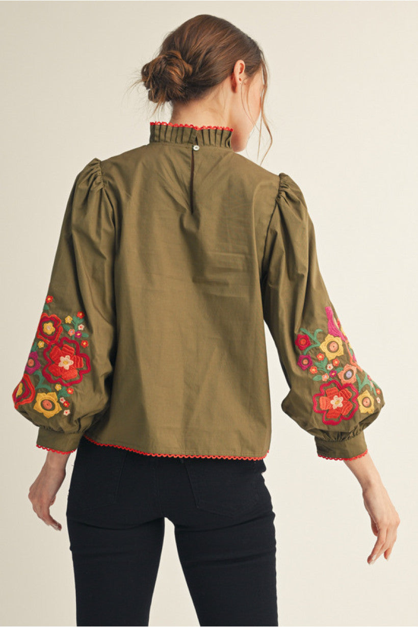Olive 3/4 balloon sleeves top with embroidery, ruffled mock neck, lace trim edge detail.