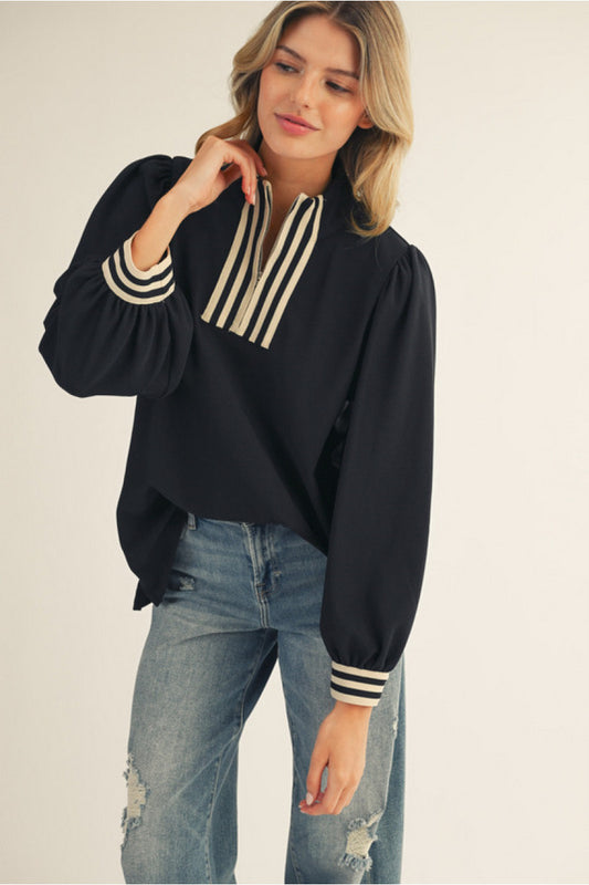 Long sleeves solid ribbed fabric high neck top with color rib band accent, front zip up, side slit.