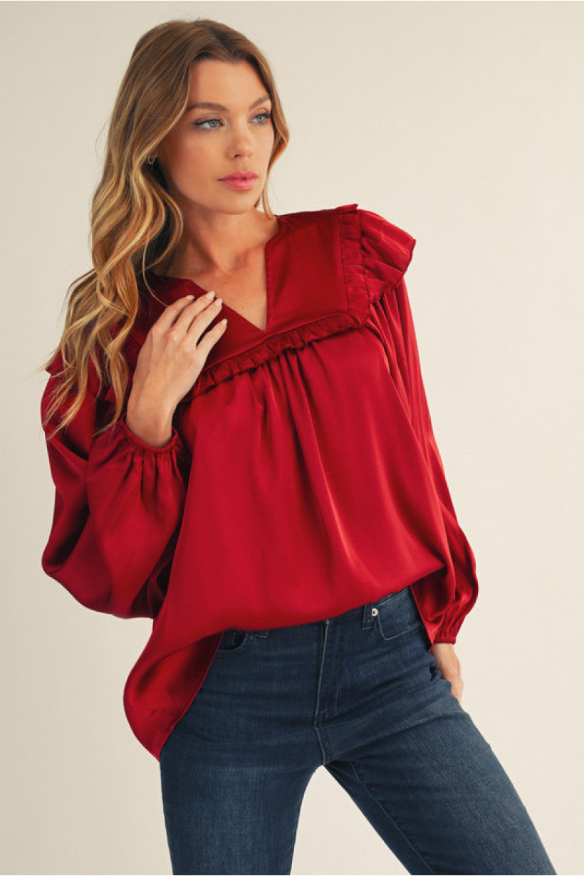 Burgundy Long puff sleeves solid satin top with ruffle detail.
