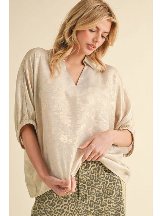 Pearl Metallic top with open collared neck, Half dolman sleeves, and stretch-band cuffs.