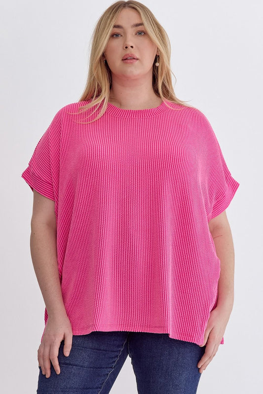 Hot Pink Ribbed short sleeve top featuring asymmetrical hem.