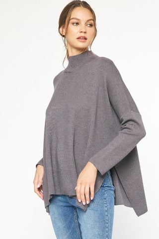 Charcoal mock neck long sleeve top featuring slits at sides.