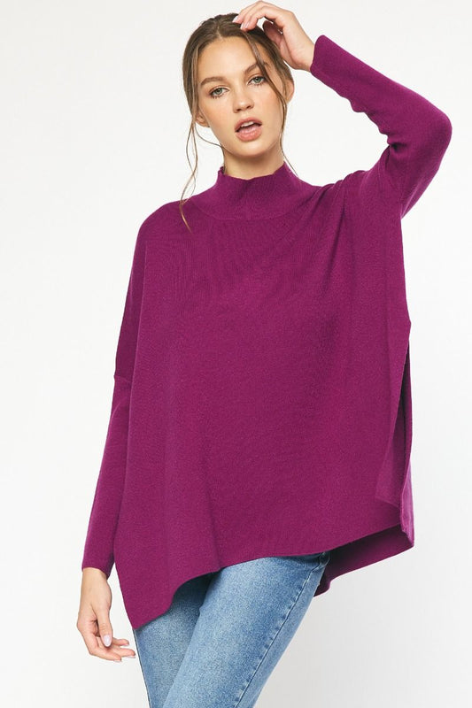 Plum mock neck long sleeve top featuring slits at sides.