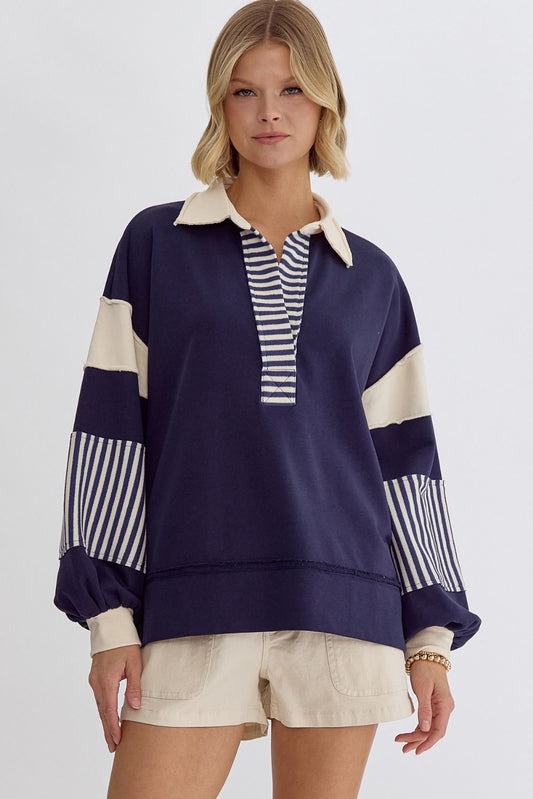 Navy notched collared long sleeve sweatshirt top featuring mixed stripe and colorblock