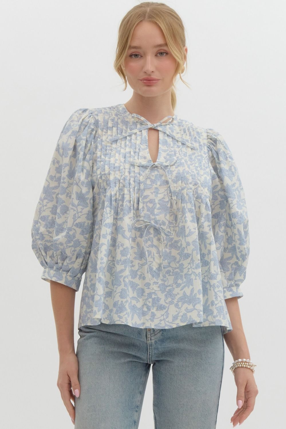 Floral print ¾ puff sleeve pullover top featuring pintuck detail at front