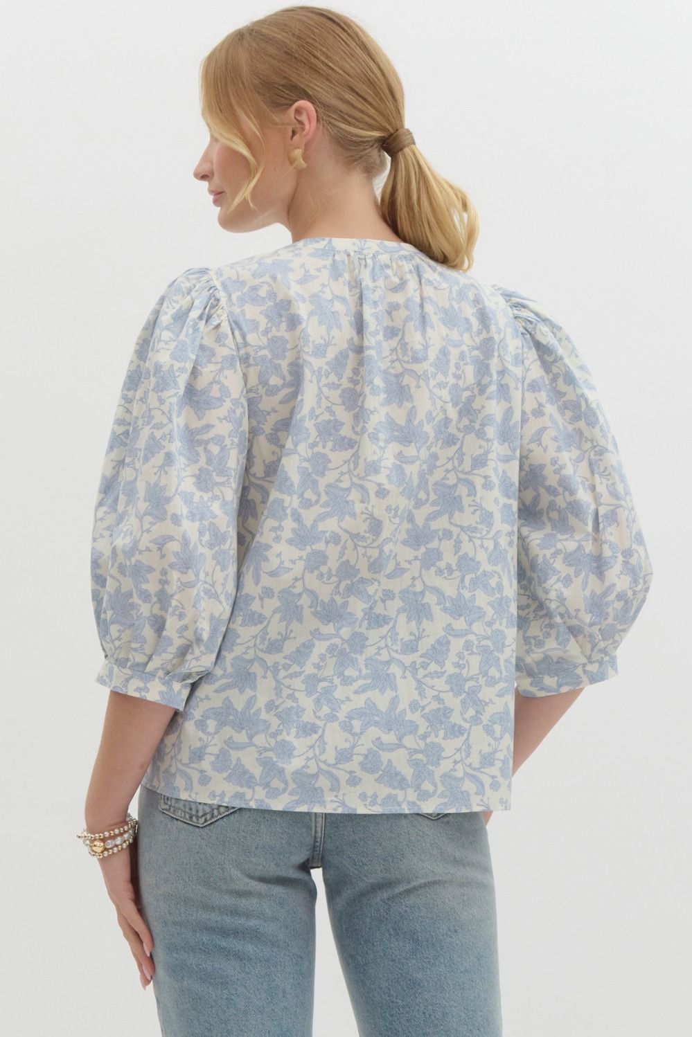 Floral print ¾ puff sleeve pullover top featuring pintuck detail at front