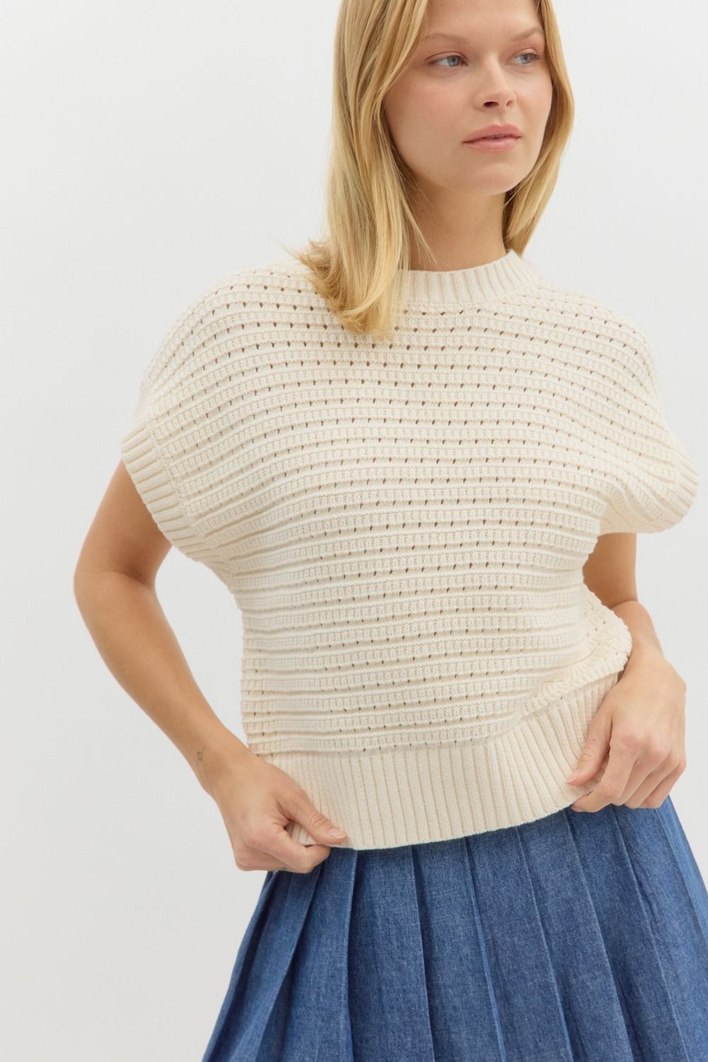 Cream solid sweater knit sleeveless top