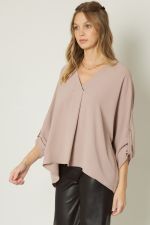 Toast V-neck 1/2 sleeve top featuring button detailing at sleeves.