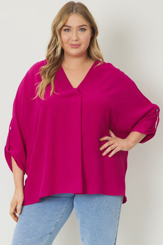 Magenta V-neck 1/2 sleeve top featuring button detailing at sleeves