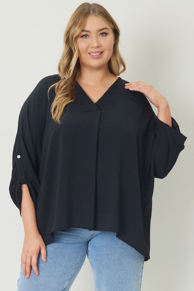 Black V-neck 1/2 sleeve top featuring button detailing at sleeves